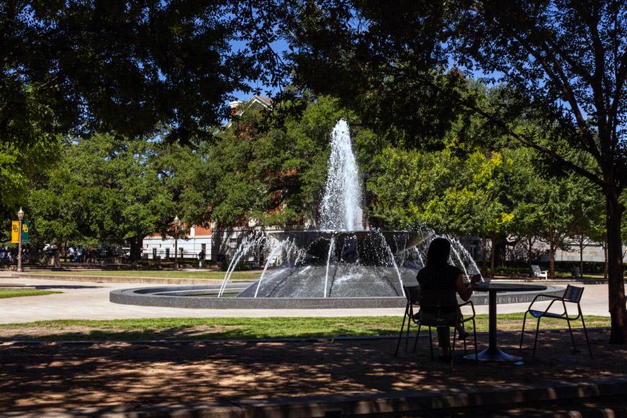 Enjoying a break by Rosenbalm Fountain on a warm summer day