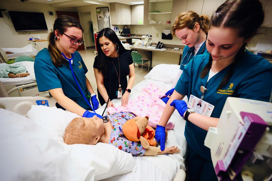 Baylor nursing students demonstrate care practices in a simulation lab