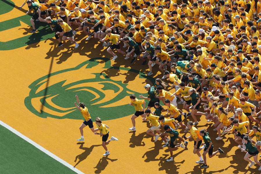 Students running the Baylor Line at McLane Stadium
